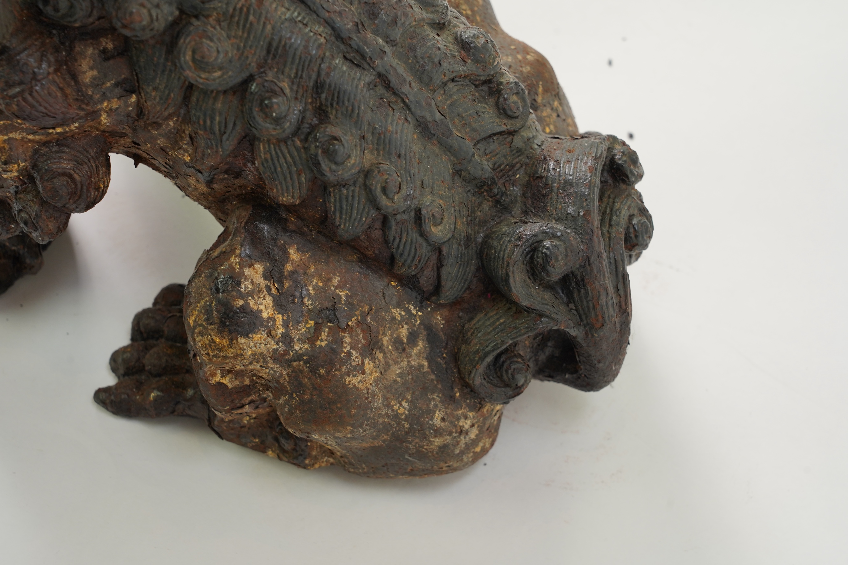 A pair of large Chinese polychrome lacquered cast iron models of lion temple guardians, Qing dynasty